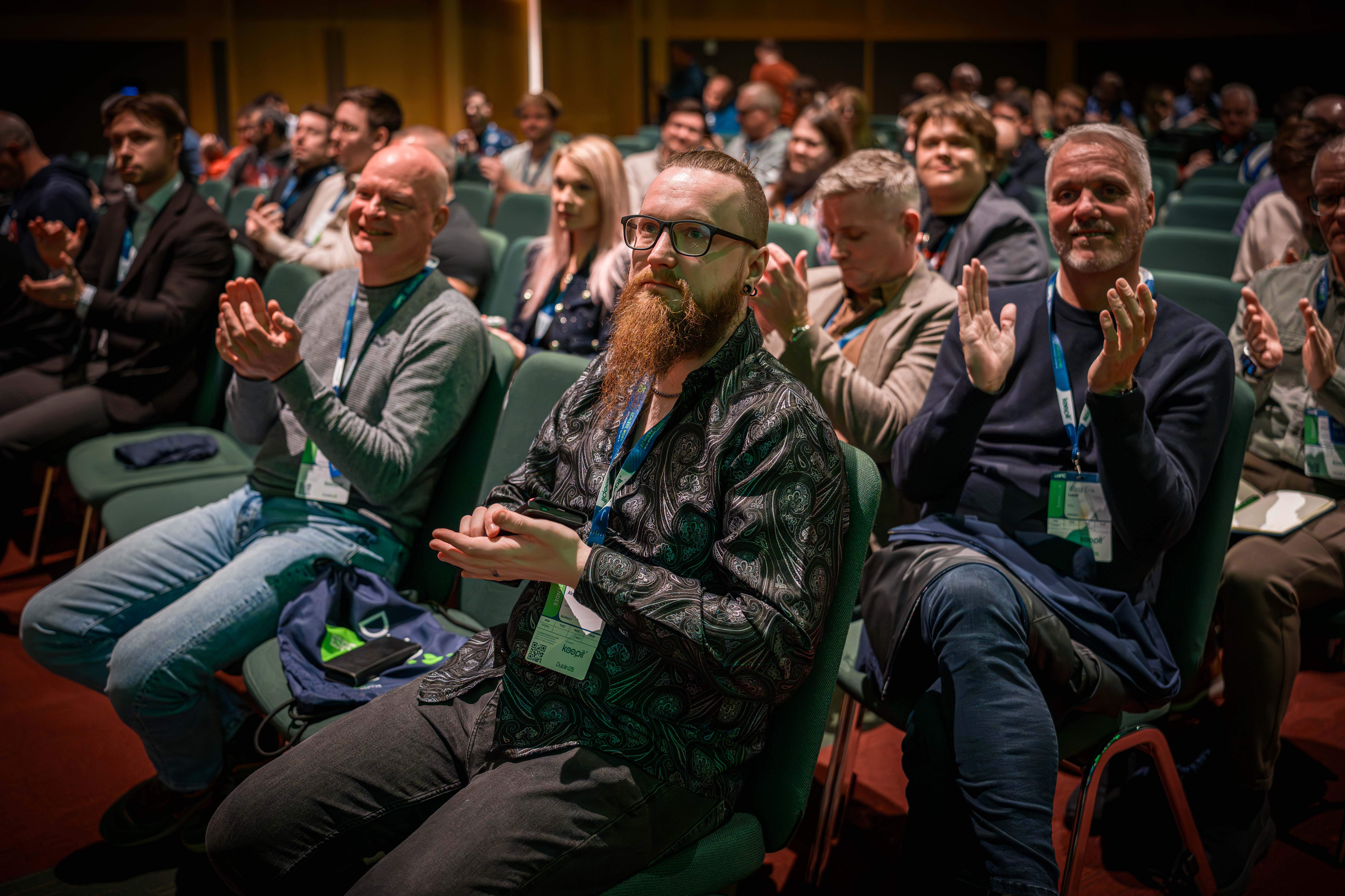 Group attending a session, happy and clapping