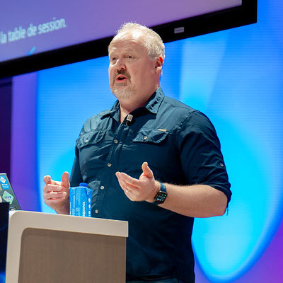 Speaker at podium. Nick Doelman