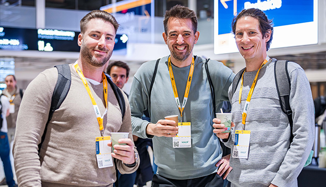 Three delegates posing for the camera with coffee at ESPC25