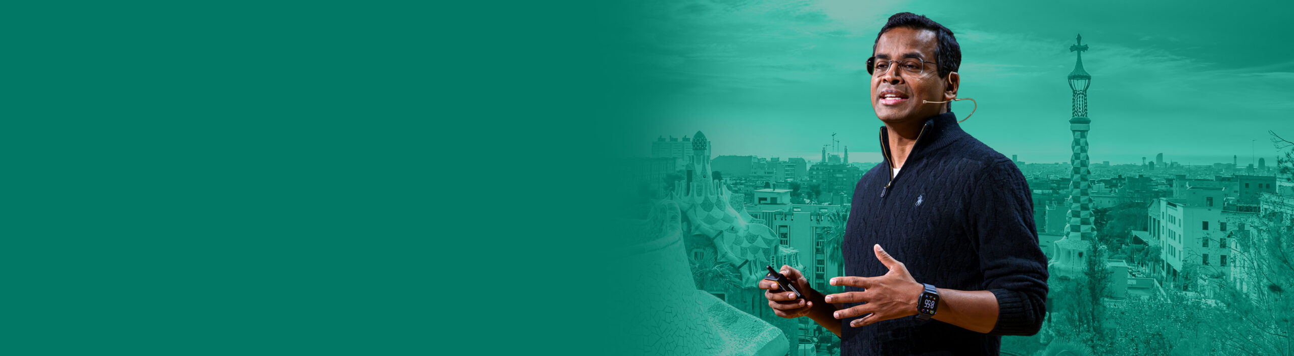 FabCon Europe Keynote speaker standing in front of the Barcelona skyline