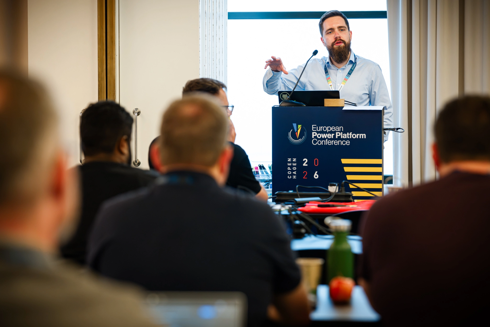 Speaker stands in front of a packed classroom